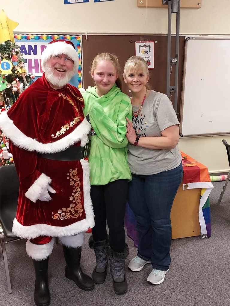 Santa Mrs. Rogers and a student