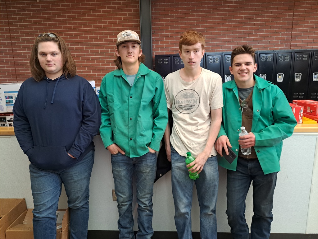 four welding students